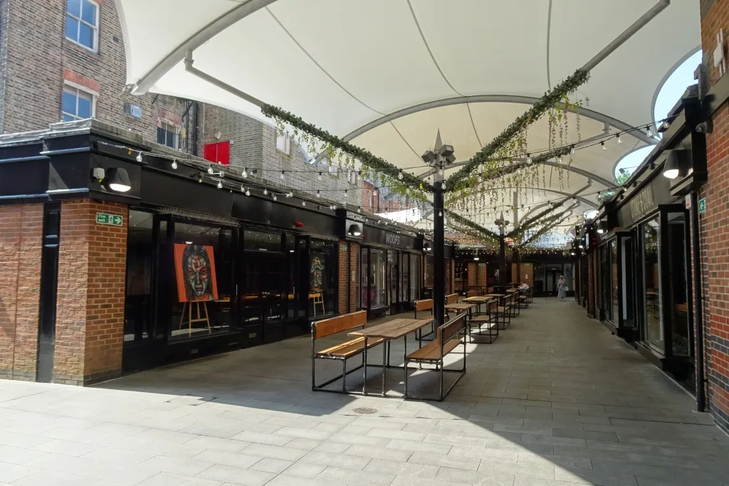 An open-air seating area at Royal Victoria Place. It is not Palm Court, which is inside the centre