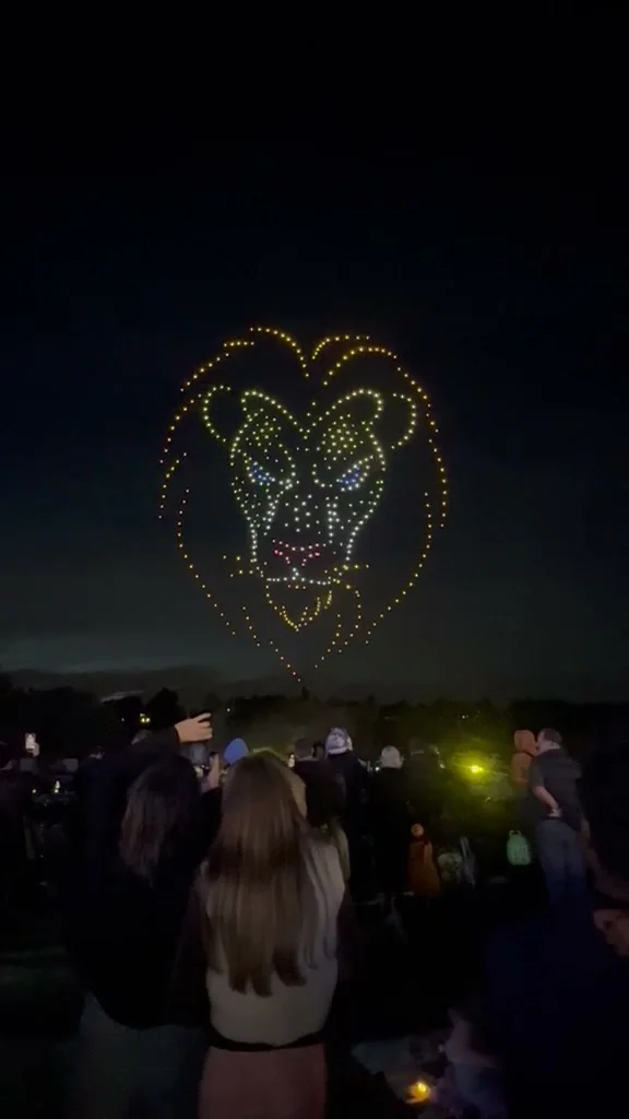 Drones form a lion's head above the crowd at Dunorlan Park